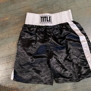 Title black and white size XXL boxing shorts.